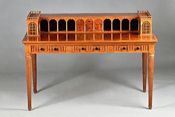 David Linley; a walnut and mahogany writing table of architectural Carlton House form, with marquetry decorated galleried top, resting on reeded taper