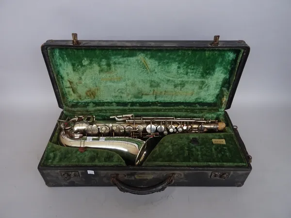 A Besson & Co 'prototype' Euphonium in a hard case and a Douchet & Co silver plated saxophone, also cased. (2)