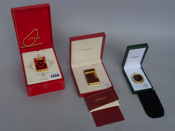 A Dupont gold plated lighter, 'Teatro', limited edition 986/2500, with certificate and box 5.7cm high, one further Dupont cased lighter and a Davidoff