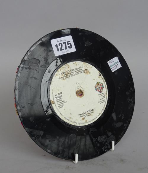 Jim Lambie, (b.1964) Untitled (eye to eye) vinyl record, wool and glue, 17.5cm dia. DDSProvenance; ex Christie's lot 37, Post War and Contemporary Art