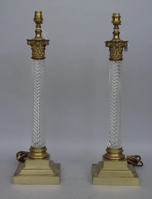 A pair of Victorian style brass and glass table lamps, each of spiral twist, corinthian column form, 48cm high. (2)