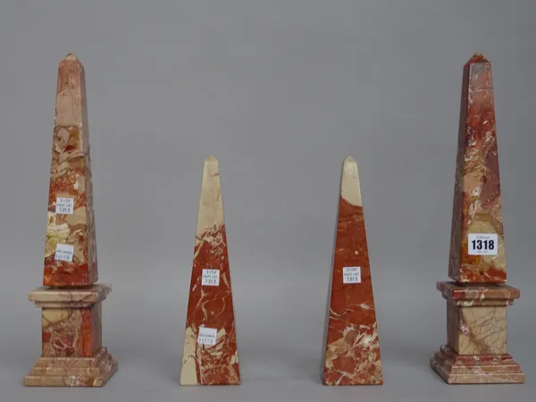 A pair of marble obelisks, rouge griotte on a stepped square plinth, 35cm high and a similar smaller pair of obelisks, 24cm high, (4).