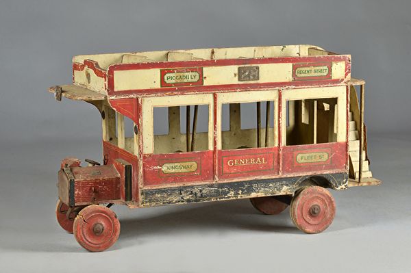 A scale model 'London bus', mid-20th century, polychrome painted wood, (a.f.), 93cm wide.