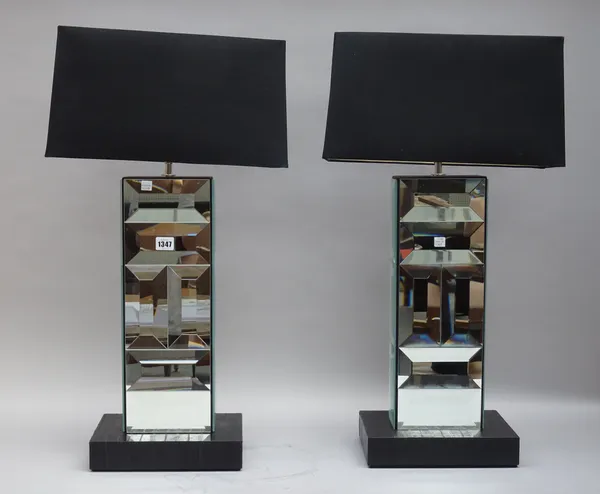 A pair of modern glass mounted table lamps, each on a leather rectangular base, with shades, 75cm high overall. (2)