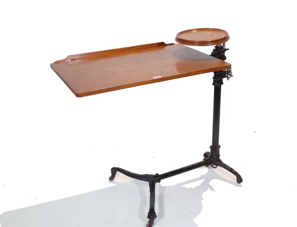 A late Victorian oak adjustable reading stand, on a black painted cast iron base, 83cm wide x 47cm deep x 73cm high. Provenance; property from the lat