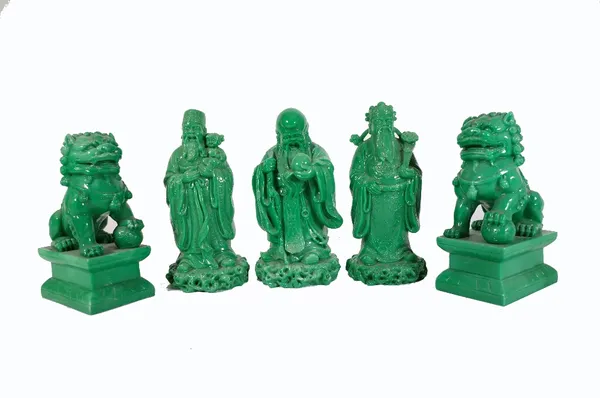 A group of modern faux spinach jade figures, comprising; a pair of dogs of fo and thee immortals, the largest 20cm high. Provenance; property from the