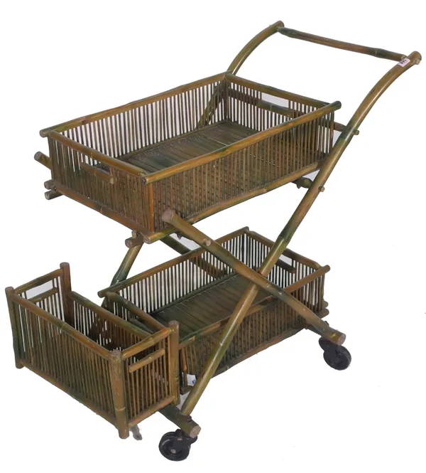 A 20th century bamboo two tier serving trolley, 87cm wide x 81cm high. Provenance; property from the late Sir David Tang This lot has been imported fr