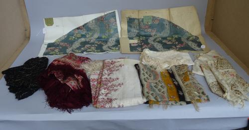 A quantity of textiles including two French brocades, a child's dress, green vintage dress, a bolero and floral printed shawls, (qty.).