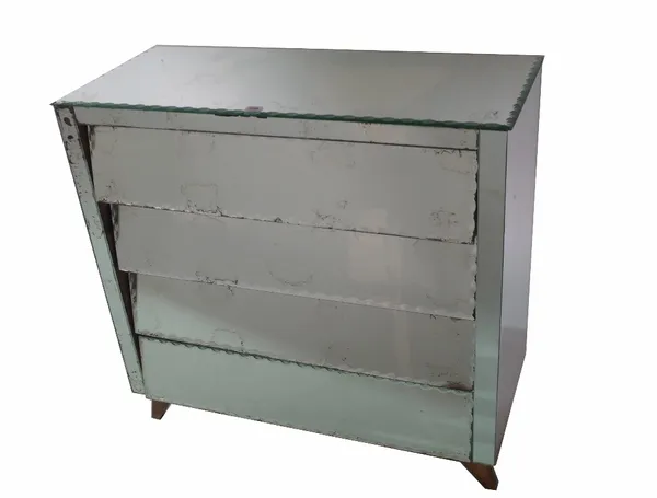 An early 20th century mirrored chest, with four long angular drawers, with bevelled borders, 90cm wide x 39cm deep x 87cm high. Provenance; property f