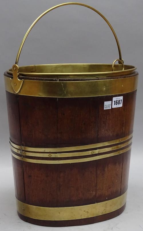 A George III and later brass bound cooper made peat bucket, 34cm wide x 34cm high.