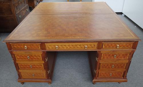A large early 20th century French gilt metal mounted cube parquetry inlaid walnut pedestal desk with nine drawers about the knee and matching verso, 1