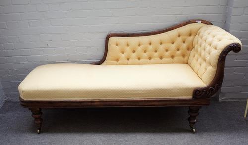 An early Victorian rosewood scroll back chaise longue, on baluster octagonal supports, 195cm wide x 94cm high.