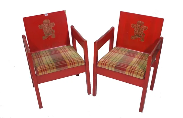 A pair of Prince Charles investiture chairs, designed in 1969 by Lord Snowdon, red painted Welsh ash laminate and gilt with Prince of Wales feathers a