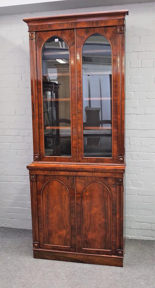 A William IV rosewood bookcase cabinet, the pair of painted arch glazed doors over panel cupboards on plinth base, reduced 96cm wide x 230cm deep.