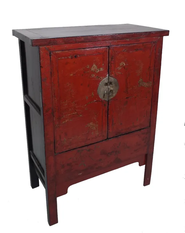 An early 20th century red laqueur Chinese side cabinet, 95cm wide x 46cm deep x 175cm high. Provenance; property from the late Sir David Tang This lot