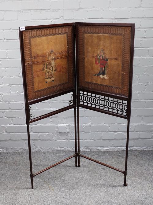 Attributed to Thomas Chippendale; an 18th century mahogany two fold fire screen, with original painted paper panels, depicting Chinese officials over