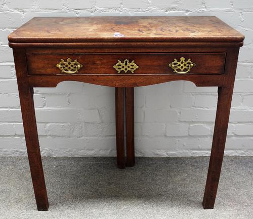 A mid-18th century mahogany rectangular tea table, on double fold-out canted square supports, 77cm wide x 72cm high.
