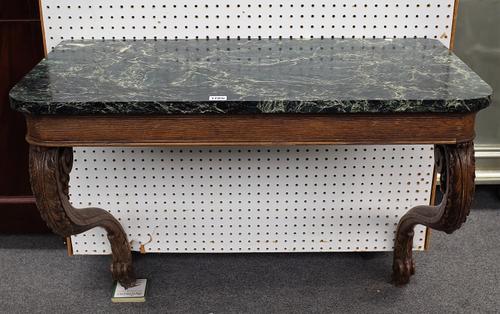 A 19th century console, the rounded rectangular marble top on a pair of oak acanthus carved scroll brackets, 92cm wide x 75cm high.