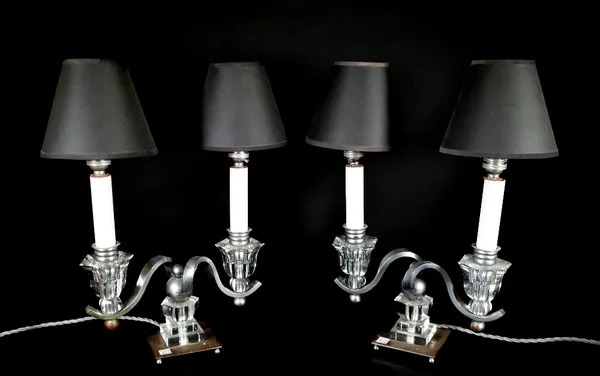 A pair of silvered metal and glass three light table lamps, 31cm wide, a pair of white metal and glass two branch table lamps with black shades and on