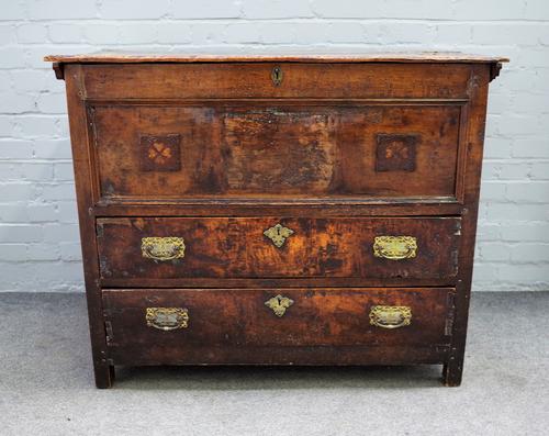 A 17th century Continental walnut mule chest with lidded top over two long drawers on block feet, 111cm wide x 89cm high.