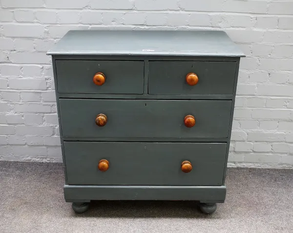 A 19th century later grey painted chest of two short and two long drawers, on bun feet, 84cm wide x 89cm high.