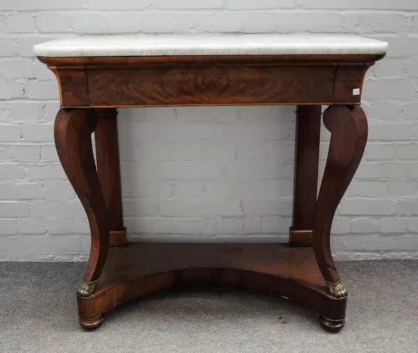 A 19th century Continental console table, the marble top over a mahogany single frieze drawer base on sabre supports and gilt metal paw feet, 97cm wid