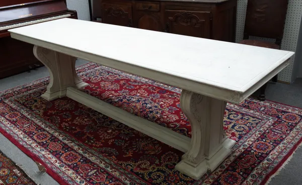 A faux painted marble console table, 20th century, the rectangular top on a pair of scroll slab trestle supports, 260cm, wide x 78cm high.