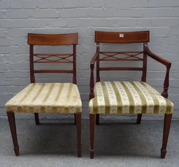 A set of ten late George III style inlaid mahogany dining chairs, each with diamond waist rail on tapering supports, (10).