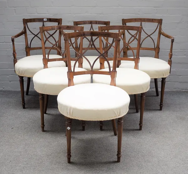 A set of six Hepplewhite revival mahogany dining chairs, with interlaced splat over circular seat, on turned supports, to include a pair of carvers, (