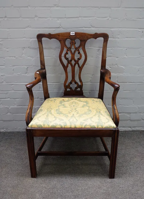 A mid-18th century mahogany carver chair, with pierced splat on canted block supports, 62cm wide x 95cm high.