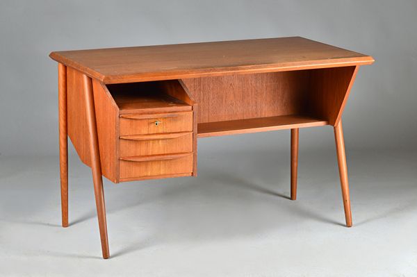 Made in Denmark Designed; a mid-20th century teak desk, the rectangular top over a pair of recesses and three drawers on turned supports, 116cm wide x