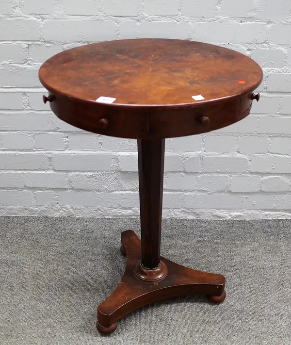 A William IV mahogany circular occasional table with four true and four dummy frieze drawers on tapering octagonal column and triform platform, 52cm d