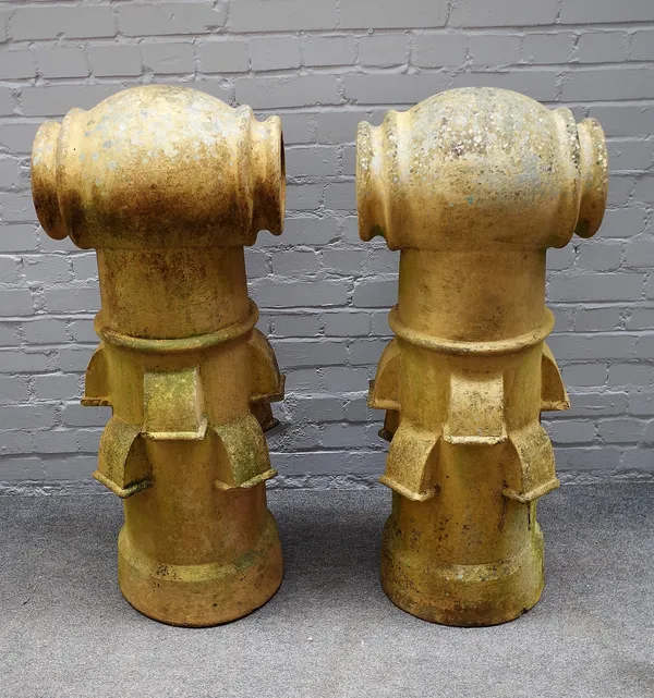 A pair of terracotta chimney pots of 'TEE-TOP' outline, 110cm high, (2).