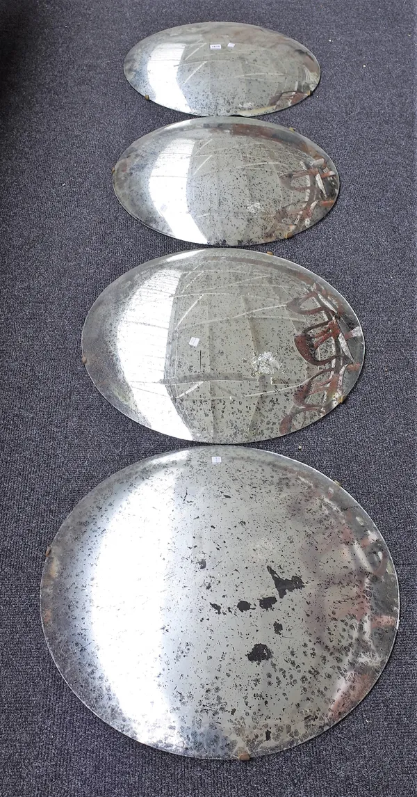 A set of four convex wall mirrors with pitted plates, each approx 58cm diameter, (4).