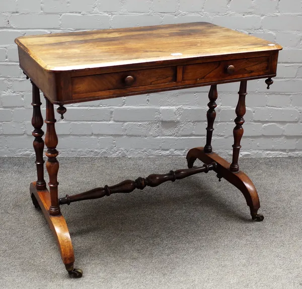 A 19th century rosewood rectangular two drawer writing table, on turned supports, 85cm wide x 74cm high.