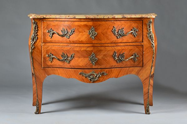 A Louis XV style commode, the marble top over a gilt metal mounted walnut bombe two drawer base, on slender cabriole supports, 127cm wide x 92cm deep.