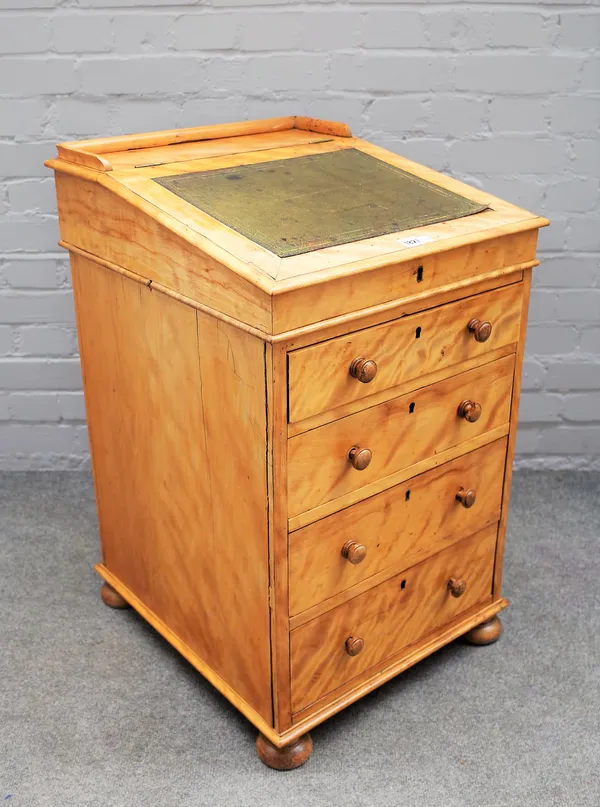 A Victorian satin birch Davenport, the slope top over four long graduated drawers on bun feet, 49cm wide x 80cm high.