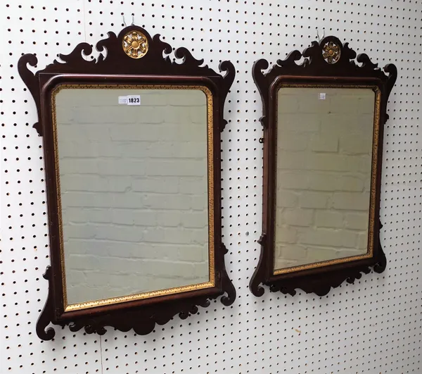 A pair of George III style parcel gilt mahogany fret cut mirrors with bevelled plates, 53cm wide x 75cm high, (2).