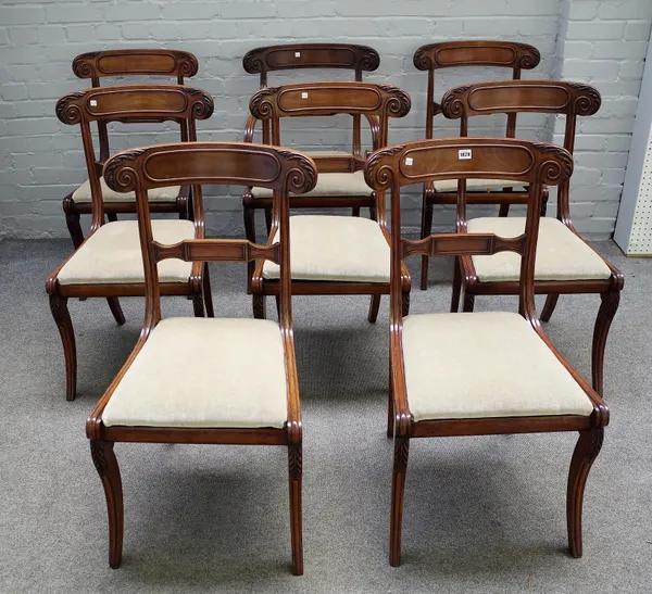 A set of eight late Regency mahogany dining chairs, with tablet twist rail and sabre supports, to include a pair of carvers, (8).