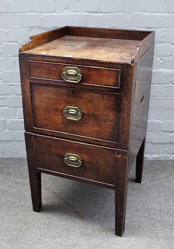 A George III mahogany night stand, the galleried top over two drawers and cupboard, 46cm wide x 84cm high.