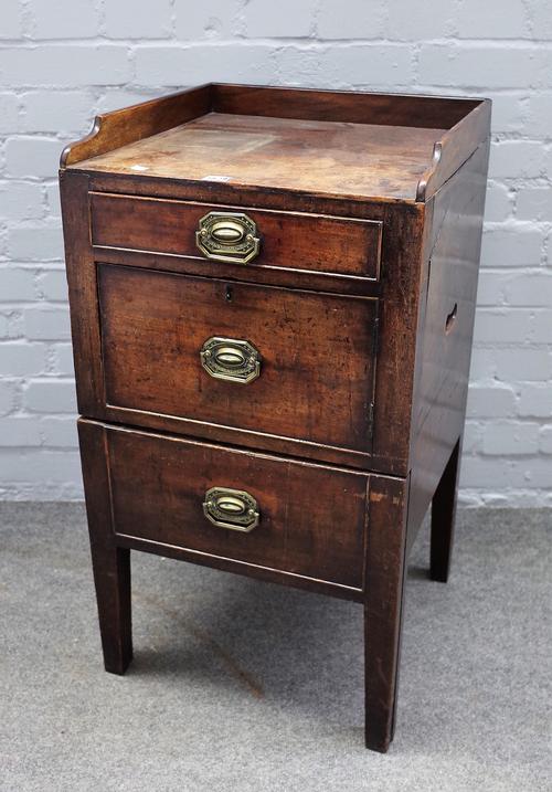 A George III mahogany night stand, the galleried top over two drawers and cupboard, 46cm wide x 84cm high.