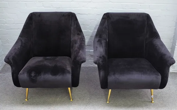 A pair of retro design black upholstered easy armchairs, on turned lacquered brass supports, 82cm wide x 90cm high, (2).