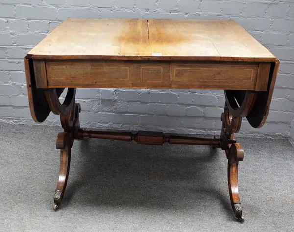 A Regency inlaid rosewood sofa table with a pair of frieze drawers on four downswept supports, united by turned stretcher, 88cm wide x 71cm high.