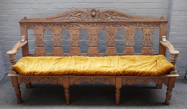 An 18th century style limed oak bench, with silhouette baluster splat back, on turned supports, 195cm wide x 109cm high.  7