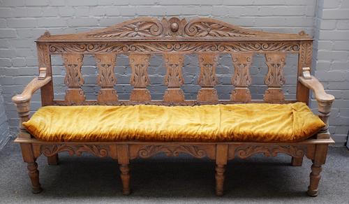 An 18th century style limed oak bench, with silhouette baluster splat back, on turned supports, 195cm wide x 109cm high.  7