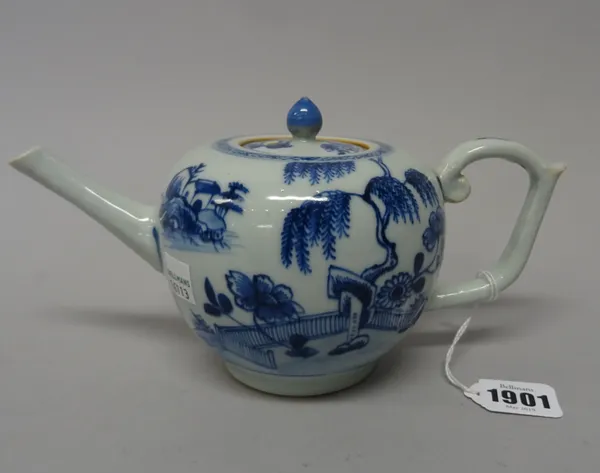 A Chinese blue and white bullet-shaped teapot and cover from the Nanking Cargo, circa 1750, painted each side with a willow tree and peony issuing fro