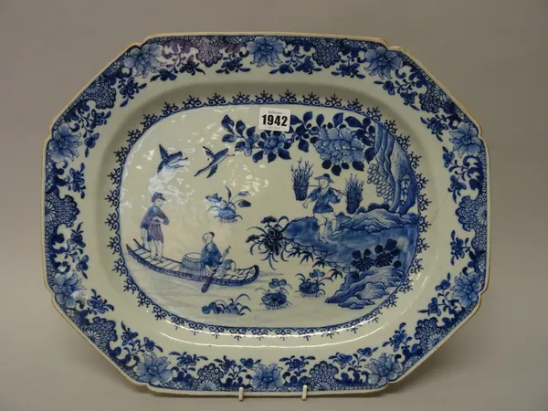 A Chinese blue and white export octagonal dish, Qianlong, painted with two figures on a river, a man carrying bundles of wood on the bank beside, 42cm