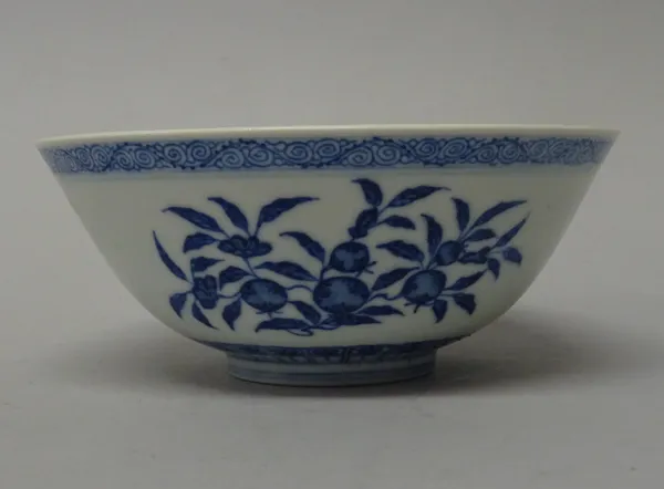 A Chinese blue and white bowl, blue Daoguang seal mark but later, painted on the exterior with branches of fruit, the interior painted with a leafy pe