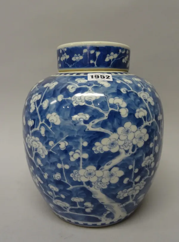 A Chinese blue and white oviform jar and cover, circa 1900, painted with branches of peony on a `cracked ice' ground, 26.5cm. high, (2).