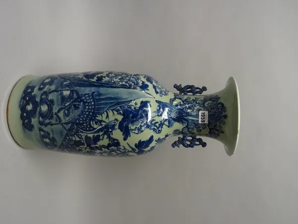 A Chinese blue and white celadon-ground two-handled baluster vase, painted with a deer beneath a bird in branches amongst flowers and rocks, 58cm. hig